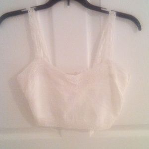 A crocheted white cropped top tank. Very sweet looking.